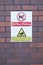 No dog fouling cctv warning sign on wall at public office workplace security prevent disease to workers children people