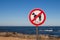 No dogs sign and Atlantic ocean