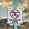 No Drone zone sign against the sky