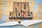 No drones sign or banner in wood type