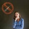 No drugs woman smiling hand on chin on blackboard background