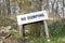 No dumping fly tipping sign in countryside woodland