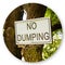 No Dumping road sign indicating in the countryside with sign hanging on the tree trunk - Round icon concept image