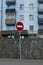 No entry road round red sign with white brick.