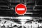 No entry sign in the underground parking. Blurred black and white background