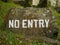 No entry warning white sign on a stone