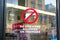 No firearms allowed on premises sign on the glass entrance door to establishment notifies patrons that weapons aren`t allowed