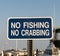 No fishing and No crabbing sign in a marina