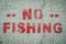 No Fishing Sign On Cement