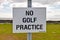 No golf practice sign with clouds, grass and sky