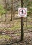 No hunting sign in a wooded setting