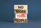 No more toxic people symbol. Concept words No more toxic people on wooden blocks on a beautiful grey table grey background.