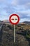 No overtaking road sign in volcanic