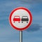 No overtaking road traffic sign on background of blue sky with clouds. Warning and information road traffic street sign, complianc