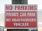 No parking private car park no authorized vehicles sign on post