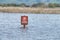 No parking sign, flooded parking lot