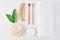 No plastic zero waste concept. Eco friendly wooden bamboo toothbrushes, towel, tooth powder, comb and washcloth on a white