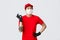 No problem, deliver your parcel. Cheerful asian delivery guy in red uniform, show okay sign and wink, ensure package