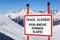 No skiing track closed avalanche danger slope. Security interdiction sign with black text on white background in red frame against