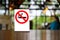 No smoking sign with shopping place background on wooden table