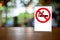 No smoking sign with shopping place background on wooden table