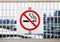 No smoking sign or symbol on white railing