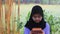 No sound Sitting Indonesia Muslimah or Islam girl playing kalimba at yard