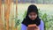 No sound Standing Indonesia Muslimah or Islam girl playing kalimba at yard