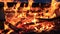 No sound. Twenty-five 25 seconds. Extreme close-up of burning picnic bench at the end of a party.