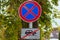 No Stopping sign with table car crossed out by a red line under it. Concept of road sign. Problem with parking