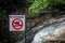 No swimming sign at Aanaivaari Muttal Waterfalls located in Kalvarayan Hills near Attur, Salem district, India