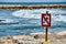 no swimming sign, photo as a background , in saint maries de la mer sea village Camargue, france