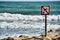 no swimming sign, photo as a background , in saint maries de la mer sea village Camargue, france