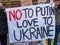 No to Putin, love to Ukraine sign, held up by anti-war protestors. London UK.