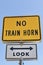 No train horn sign against blue sky