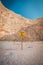 No Trespassing sign on a pole with rope near cliff, warning falling rocks, Greece Zakynthos beach Navagio near shipwreck