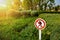 No tresspassing, crossing, and entering sign isolated in front of garden