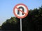 No U-turn sign, a regulatory sign posted at intersections to indicate the driver is not legally allowed to make a U-turn