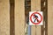 No walking pedestrian warning sign nailed down to the wooden boards