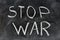 No war, handwritten with a chalk on the blackboard