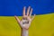 No war sign on female hand. Ukrainian flag