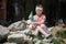 No war in Ukraine. girl near a destroyed house in Ukraine.