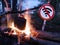 The no wifi sign near the fire and pot on the beach. digital detox concept and break from technology.