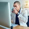 No wont stop until he meets his deadlines. a young businessman drinking coffee while working in an office.