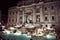 Nocturnal photograph of the illuminated Trevi fountain