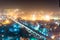 Noida metro station at night against the cityscape