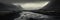 A noir panoramic view of hills and a river with mist