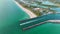 Nokomis beach ocean inlet with sailing boats and North and South Jetty in Sarasota county, USA. Many people enjoying