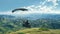 Nomad on glider, soaring above green hills, contemplating the expanses of the world.Inspirational, with landscape and