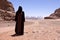 Nomadic woman with burka in wadi rum